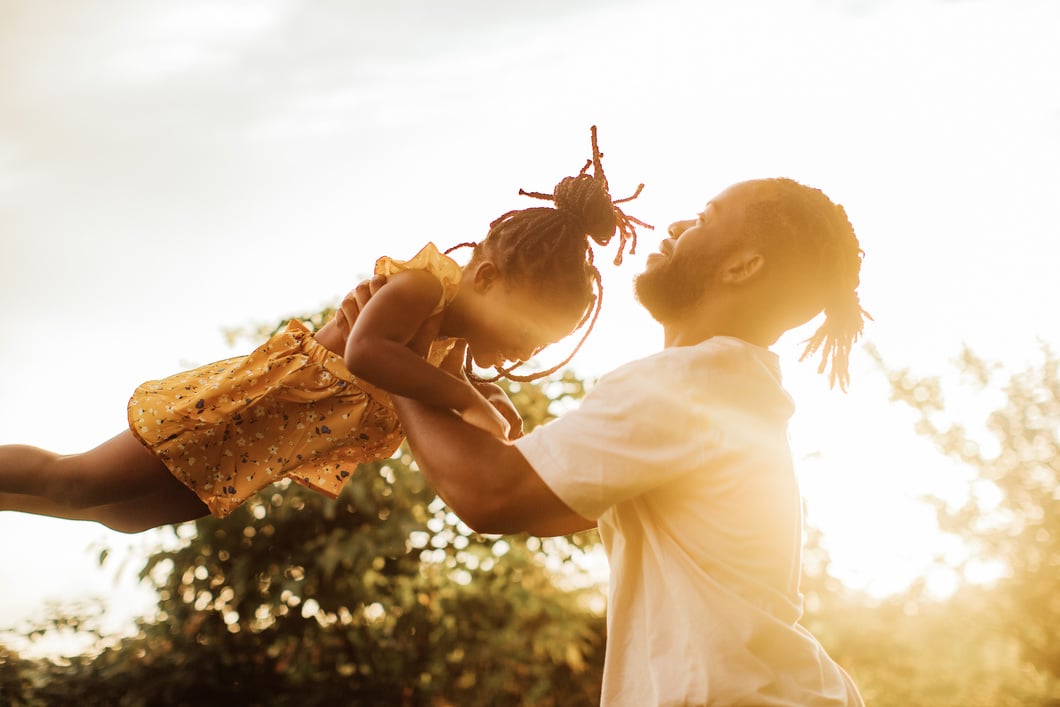 Father and Daughter Playing Outdoors 